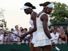 Serena Williams (left) and her sister Venus Williams in action during their first-round doubles match on Day 2 at Wimbledon in 2010. Serena Williams (left) and her sister Venus Williams in action during their first-round doubles match on Day 2 at Wimbledon in 2010.