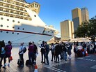 Passengers queue at Sydney's Circular Quay to board the Carnival Spirit for a Pacific cruise, on Thursday. Passengers queue at Sydney's Circular Quay to board the Carnival Spirit for a Pacific cruise, on Thursday.