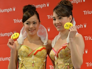 Models from Triumph International display the new "Branomics Bra" on Wednesday in Tokyo.