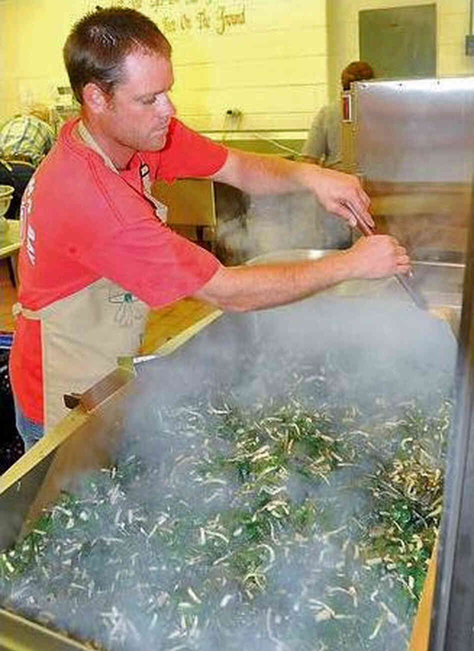 Apprentice cook Ryan McClung sautées ramps for the 2012 ramp festival in Richwood, West Va. Apprentice cook Ryan McClung sautées ramps for the 2012 ramp festival in Richwood, West Va.