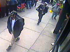This image from a surveillance video, taken near the finish line of the Boston Marathon, helped investigators identify Tamerlan Tsarnaev (in black cap) and his brother, Dzhokhar (in white cap), as the main suspects in the bombings. This image from a surveillance video, taken near the finish line of the Boston Marathon, helped investigators identify Tamerlan Tsarnaev (in black cap) and his brother, Dzhokhar (in white cap), as the main suspects in the bombings.