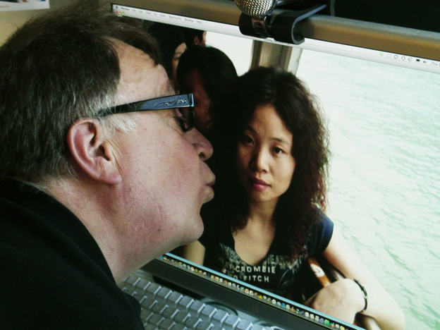 Steven kisses a photo of Sandy, his bride from China. Steven kisses a photo of Sandy, his bride from China.