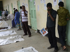 Relatives on Sunday attempt to identify the bodies of loved ones following from the collapse of Rana Plaza in Savar, on the outskirts of Dhaka. Relatives on Sunday attempt to identify the bodies of loved ones following from the collapse of Rana Plaza in Savar, on the outskirts of Dhaka.