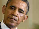 President Obama listens as British Prime Minister David Cameron speaks during their joint news conference Monday.
