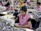 Garment workers sew T-shirts at a factory in Dhaka, Bangladesh, in 2009.