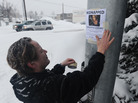 A family friend posts fliers after Samantha Koenig's disappearance in 2012. Koenig's father is now an advocate for a mandatory national missing persons database. A family friend posts fliers after Samantha Koenig's disappearance in 2012. Koenig's father is now an advocate for a mandatory national missing persons database.