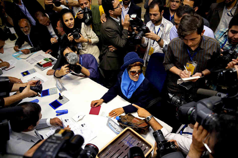 Etrat Kazemi (center) registers her candidacy for the upcoming presidential election in Tehran, Iran, last week. More than 700 people have registered to run in the June 14 election. Etrat Kazemi (center) registers her candidacy for the upcoming presidential election in Tehran, Iran, last week. More than 700 people have registered to run in the June 14 election.