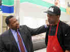 Wendell Pierce, the actor and co-owner of Sterling Farms grocery store, chats with Dwight Henry, who will be making doughnuts and buttermilk drops in the store.