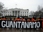 Protesters wear prison-style orange jumpsuits, handcuffs and hoods during a 2012 demonstration urging the government to close down the U.S. detention facility at Guantanamo Bay. Protesters wear prison-style orange jumpsuits, handcuffs and hoods during a 2012 demonstration urging the government to close down the U.S. detention facility at Guantanamo Bay.