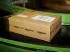 An Amazon.co.uk parcel passes along a conveyor belt at a facility in Milton Keynes, England.