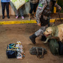 A drug-sniffing dog checks bags at a Brazilian border crossing with Bolivia on April 3. With an increase in illegal immigration and drug smuggling, Brazil is planning to build a virtual fence along its 10,000-mile border.