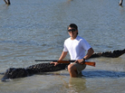 A photo provided by the Texas Parks and Wildlife Department shows Braxton Bielski with the 800-pound alligator he killed. A photo provided by the Texas Parks and Wildlife Department shows Braxton Bielski with the 800-pound alligator he killed.