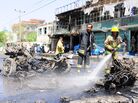 The scene Thursday in Kabul, Afghanistan, after a suicide bomber attacked a NATO convoy. The scene Thursday in Kabul, Afghanistan, after a suicide bomber attacked a NATO convoy.