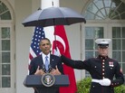 Rain fell Thursday during part of President Obama's joint news conference with Turkish Prime Minister Recep Tayyip Erdogan in the Rose Garden of the White House. Rain fell Thursday during part of President Obama's joint news conference with Turkish Prime Minister Recep Tayyip Erdogan in the Rose Garden of the White House.