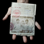 Sonny Vaahn, 25, holds his family's refugee identification in Bronx, N.Y. The card was issued to them during their initial entry into a refugee camp along the Thai-Cambodian border after the "killing fields" atrocities ended in Cambodia.