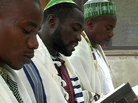 Shmuel Tikvah (center) leads morning prayers among his congregation in the southern delta city of Port Harcourt, Nigeria. Shmuel Tikvah (center) leads morning prayers among his congregation in the southern delta city of Port Harcourt, Nigeria.