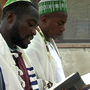 Shmuel Tikvah (center) leads morning prayers among his congregation in the southern delta city of Port Harcourt, Nigeria.