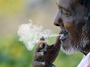 A man smokes a cigarette as he takes a break at a fruit market in Hyderabad, India. Smoking tobacco is eight times more prevalent among Indian men than women.