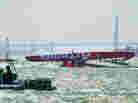 The Artemis Racing AC72 catamaran lies capsized after a training sail in San Francisco Bay on May 9.