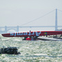 The Artemis Racing AC72 catamaran lies capsized after a training sail in San Francisco Bay on May 9.