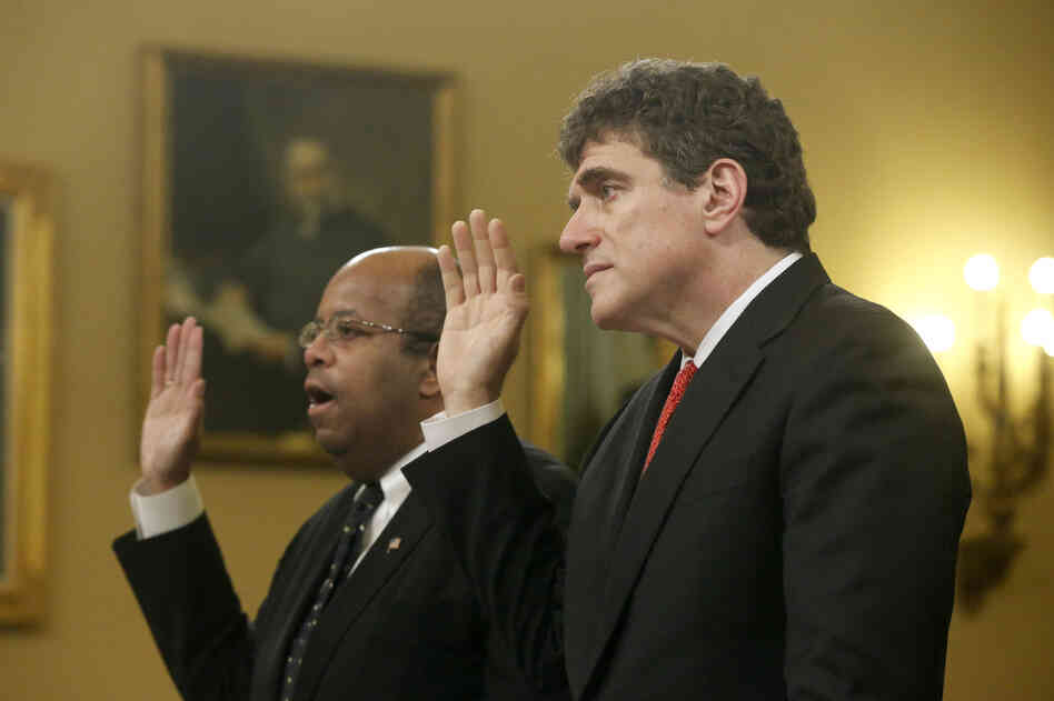 Ousted IRS chief Steve Miller (right) and J. Russell George, a Treasury inspector general, take the oath before testifying on before the House Ways and Means Committee on Friday. Ousted IRS chief Steve Miller (right) and J. Russell George, a Treasury inspector general, take the oath before testifying on before the House Ways and Means Committee on Friday.