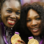 Serena (right) and Venus Williams pose with their gold medals during the London 2012 Olympic Games.