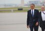President Obama walks across the tarmac to greet well-wishers on Sunday upon his arrival in Atlanta, Ga., where he will attend the commencement at Morehouse College.
