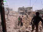 Syrians inspect Saturday the rubble of buildings damaged by government airstrikes in Qusair, Syria. The image was provided by Qusair Lens, and was authenticated based on its contents and other AP reporting.