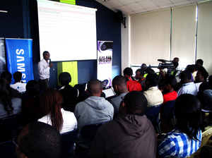 Kenyans watch a presentation at the "mobile apps garage showcase" this in Nairobi.