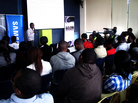 Kenyans watch a presentation at the "mobile apps garage showcase" this in Nairobi. Kenyans watch a presentation at the "mobile apps garage showcase" this in Nairobi.
