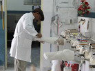 A technician shapes a cast mold for a prosthetic limb at the Red Cross orthopedic clinic in Kabul. The clinic produces about 2,000 prosthetic limbs each year. A technician shapes a cast mold for a prosthetic limb at the Red Cross orthopedic clinic in Kabul. The clinic produces about 2,000 prosthetic limbs each year.