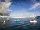 Boats line up to photograph this year's Teahupoo swell in Tahiti.