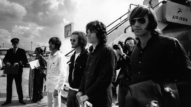 Ray Manzarek (far right) stands with fellow members of The Doors Jim Morrison (from right), Robby Krieger and John Densmore in 1968. Manzarek died Monday in Germany. He was 74.