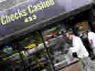 Millions of people who rely on check-cashing stores, like this one in New York City, could run into trouble buying health insurance. Millions of people who rely on check-cashing stores, like this one in New York City, could run into trouble buying health insurance.