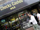 Millions of people who rely on check-cashing stores, like this one in New York City, could run into trouble buying health insurance. Millions of people who rely on check-cashing stores, like this one in New York City, could run into trouble buying health insurance.