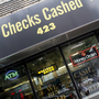 Millions of people who rely on check-cashing stores, like this one in New York City, could run into trouble buying health insurance. Millions of people who rely on check-cashing stores, like this one in New York City, could run into trouble buying health insurance.