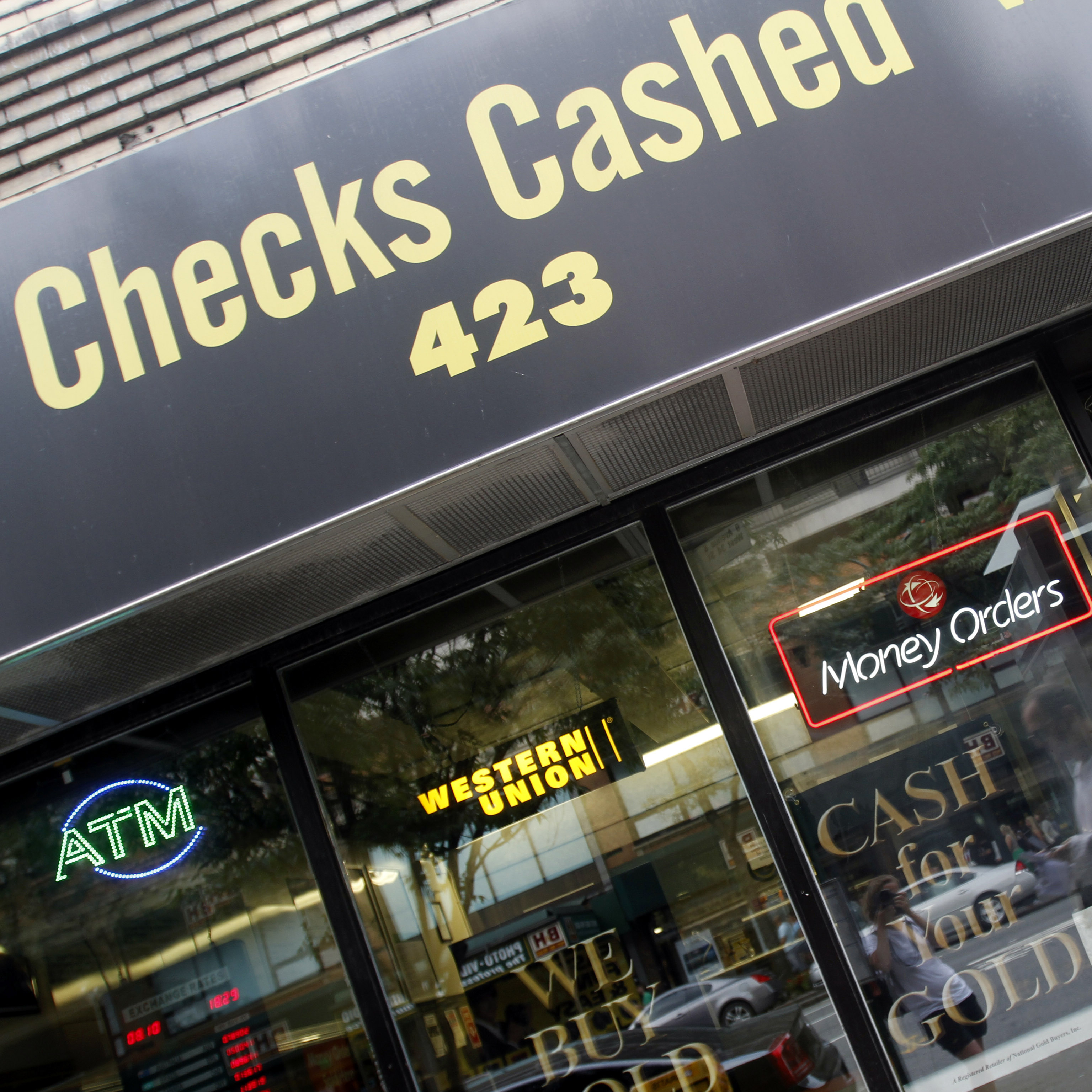 Millions of people who rely on check-cashing stores, like this one in New York City, could run into trouble buying health insurance.