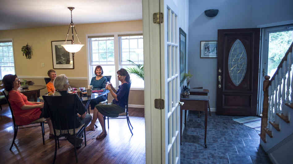 Group houses are becoming popular — again — among some single baby boomers, and not just for financial reasons. Marianne Kilkenny (second from right) shares her home in Asheville, N.C, with four other people. Group houses are becoming popular — again — among some single baby boomers, and not just for financial reasons. Marianne Kilkenny (second from right) shares her home in Asheville, N.C, with four other people.