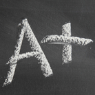 Big fat A+ written in chalk on a blackboard. Big fat A+ written in chalk on a blackboard.