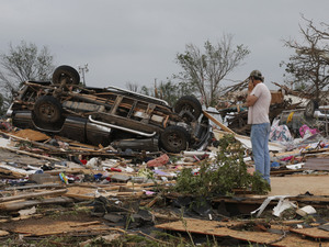 John Warner surveys the damage near a friend's mobile home in the Steelman Estates Mobile Home Park, destroyed in Sunday's tornado, near Shawnee, Okla., on Monday. John Warner surveys the damage near a friend's mobile home in the Steelman Estates Mobile Home Park, destroyed in Sunday's tornado, near Shawnee, Okla., on Monday.