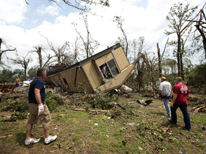 Volunteers help clean out Jean McAdams' mobile home after it was overturned by a tornado today 2013 near Shawnee, Oklahoma. Volunteers help clean out Jean McAdams' mobile home after it was overturned by a tornado today 2013 near Shawnee, Oklahoma.