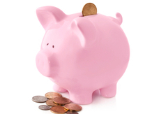 pink piggy bank with coins