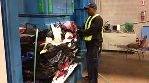 Worker Charles Lee sorts through clothes at Mac Recycling near Baltimore. Textile recycling is a huge international business, and a small facility like Mac ships about 80 tons of clothes each week to buyers around the world. Worker Charles Lee sorts through clothes at Mac Recycling near Baltimore. Textile recycling is a huge international business, and a small facility like Mac ships about 80 tons of clothes each week to buyers around the world.