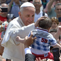 Pope Francis blesses a child Sunday after the Holy Mass at St. Peter's Square, at the Vatican.