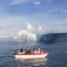 Boats line up to photograph this year's Teahupoo swell in Tahiti.
