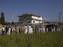 Pakistanis along with international and local media gather outside Osama Bin Laden's compound, a day after the successful raid by U.S. Special Forces.