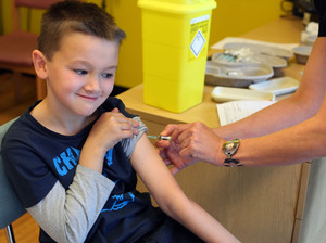 Luke Tanner, 7, gets vaccinated for measles at a clinic near Swansea, Wales, in April. Wales is at the center of a measles outbreak that has been linked to one death.