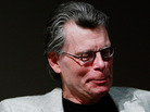 Stephen King holds a special pink Kindle given to him at a 2009 unveiling event for the Amazon Kindle 2. Stephen King holds a special pink Kindle given to him at a 2009 unveiling event for the Amazon Kindle 2.
