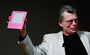 Stephen King holds a special pink Kindle given to him at a 2009 unveiling event for the Amazon Kindle 2.