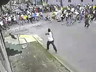 A possible shooting suspect in a white shirt (bottom center) shoots into a crowd of people on Mother's Day 2013 in New Orleans. A possible shooting suspect in a white shirt (bottom center) shoots into a crowd of people on Mother's Day 2013 in New Orleans.